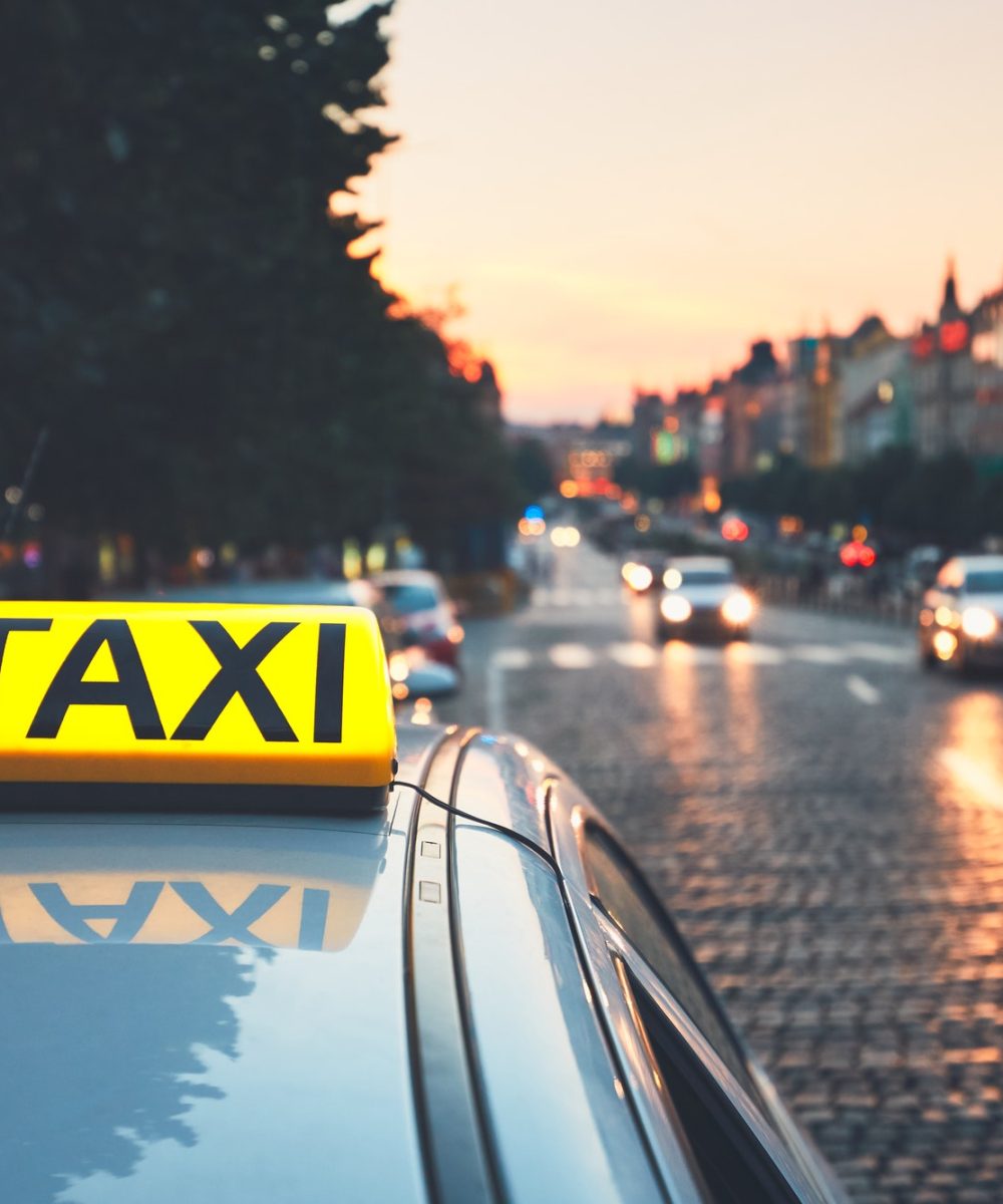 taxi-car-on-the-city-street-1.jpg